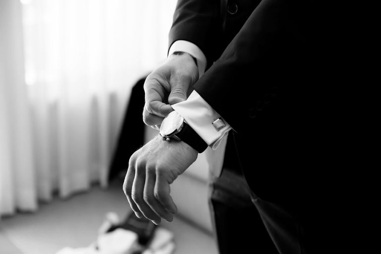 groom-adjusting-his-shirt