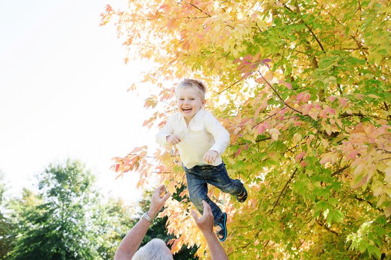 dad-throwing-his-son-in-the-air