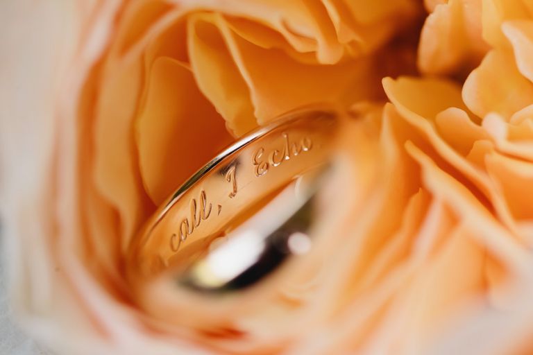 detail of the engraving in the grooms wedding ring